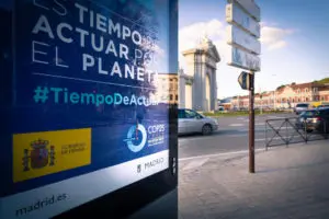 COP25 ad on a billboard in Puerta de San Vicente Square